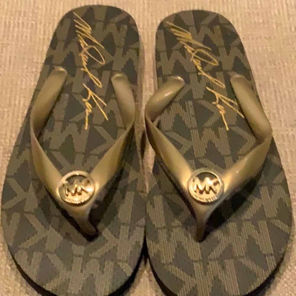 Brand New Micheal Kors Flip flops.  Women’s size 11